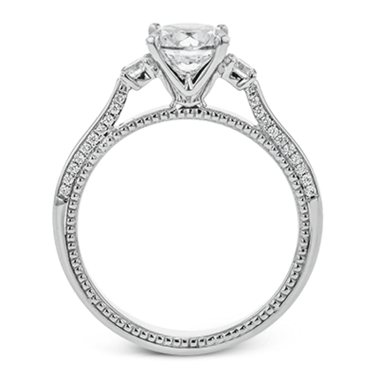 Diamond side stones, milgrain and diamond detailing on the sides of the ring add to the beauty of this unique engagement ring.