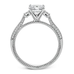 Diamond side stones, milgrain and diamond detailing on the sides of the ring add to the beauty of this unique engagement ring.