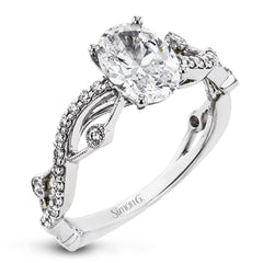 The intertwined design of this 18k gold engagement ring perfectly offsets an oval shaped center stone.