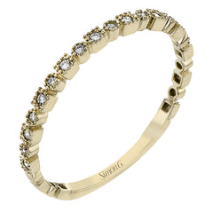 This diamond band in 14K yellow gold doubles as a stackable ring or a wedding band with 0.09 ctw of diamonds