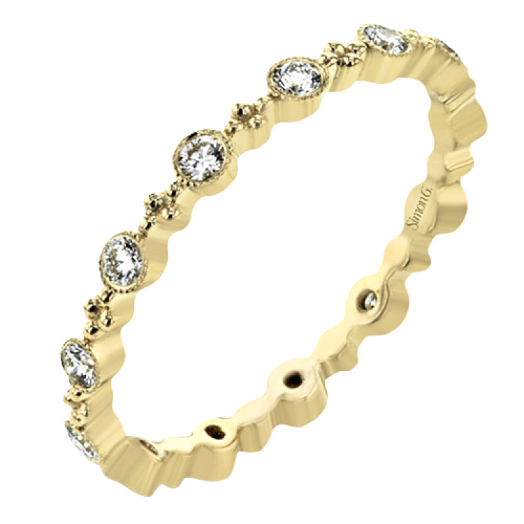 This diamond eternity band from our stackable collection in 14K yellow gold, has alternating bezel set diamonds 0.31 ctw. and gold beads.