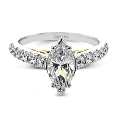 A touch of 18k yellow gold filigree on the interior of this ring adds a special touch to this 18k white gold engagement ring made for a marquise shape center stone.