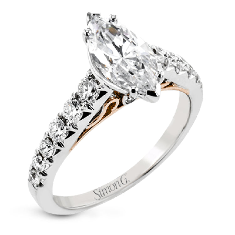 A touch of 18k yellow gold filigree on the interior of this ring adds a special touch to this 18k white gold engagement ring made for a marquise shape center stone.