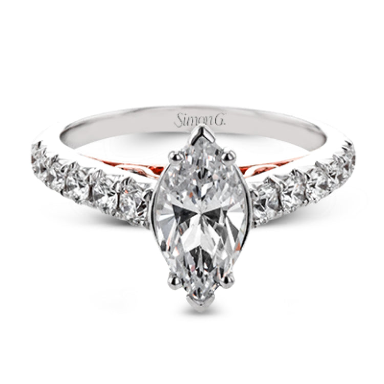 A touch of 18k yellow gold filigree on the interior of this ring adds a special touch to this 18k white gold engagement ring made for a marquise shape center stone.