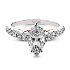 A touch of 18k yellow gold filigree on the interior of this ring adds a special touch to this 18k white gold engagement ring made for a marquise shape center stone.