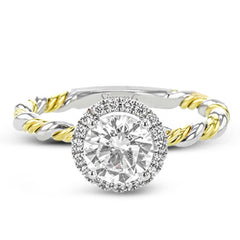 This ring is a twist on a halo engagement ring, with 18k yellow and white gold intertwining in the band.