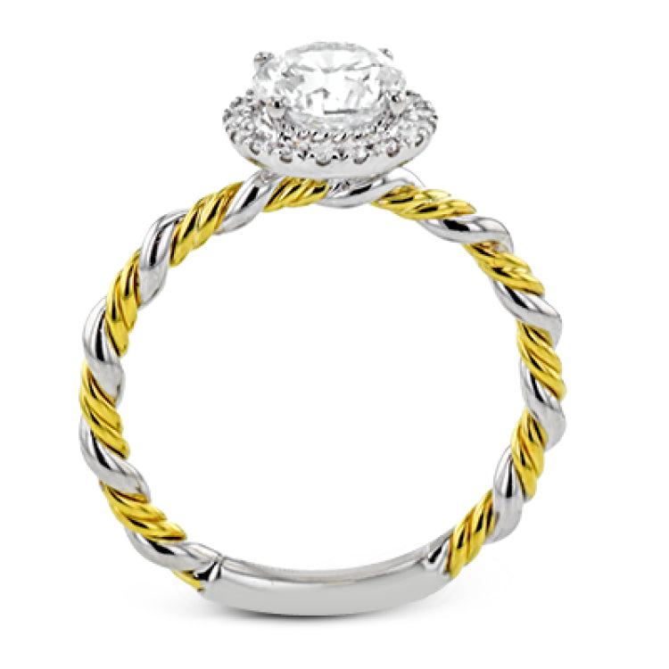 This ring is a twist on a halo engagement ring, with 18k yellow and white gold intertwining in the band.
