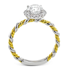 This ring is a twist on a halo engagement ring, with 18k yellow and white gold intertwining in the band.