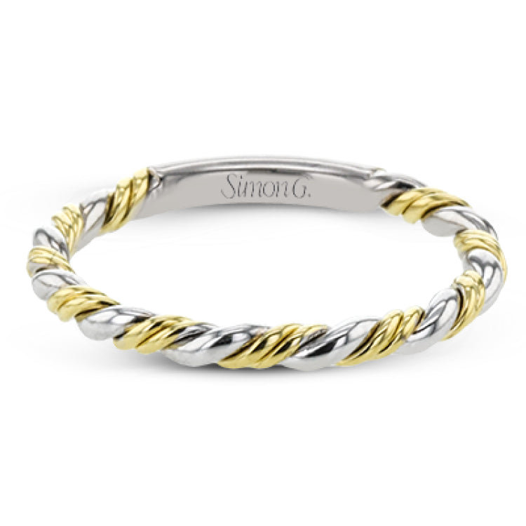 This ring is a twist on a halo engagement ring, with 18k yellow and white gold intertwining in the band.
