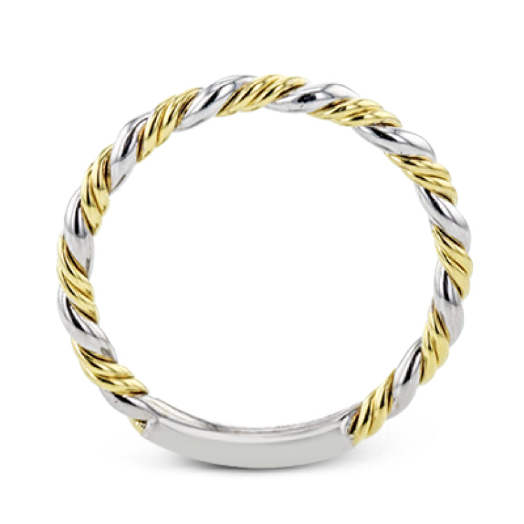 This ring is a twist on a halo engagement ring, with 18k yellow and white gold intertwining in the band.