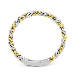 This ring is a twist on a halo engagement ring, with 18k yellow and white gold intertwining in the band.