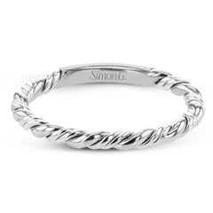 This ring is a twist on a halo engagement ring, with 18k yellow and white gold intertwining in the band.