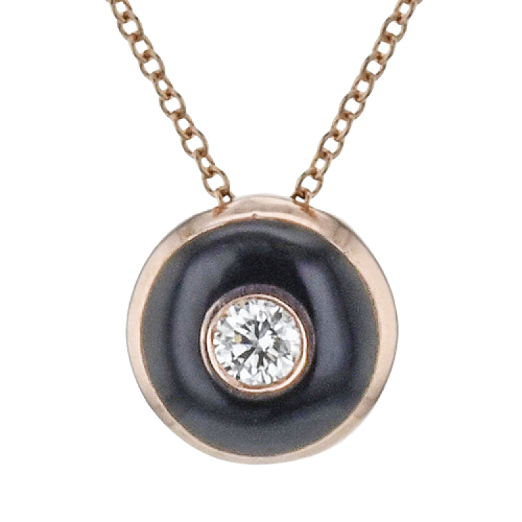 Shiny enamel surrounds the center .11 ct diamond in this dainty pendant, perfect for every day wear.