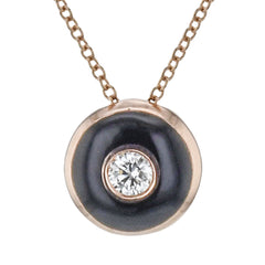Shiny enamel surrounds the center .11 ct diamond in this dainty pendant, perfect for every day wear.