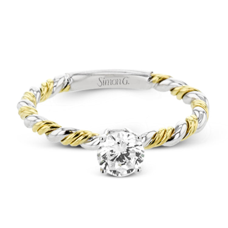 White and yellow 18k gold twine around each other in this ring that puts a twist on a classic design.
