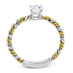 White and yellow 18k gold twine around each other in this ring that puts a twist on a classic design.