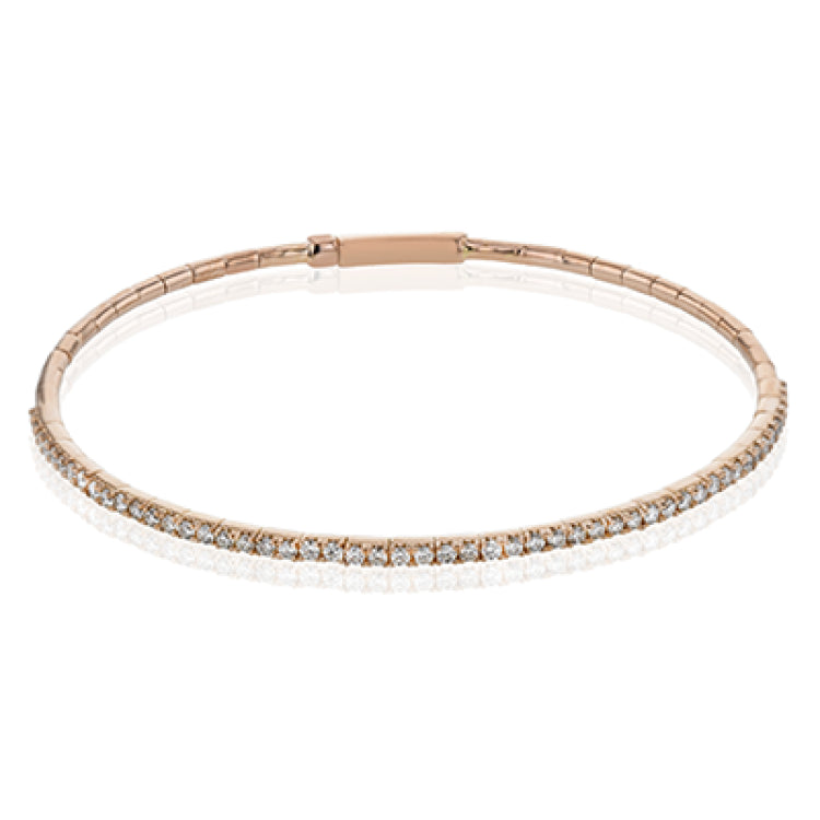 This 18K rose gold bangle bracelet featuring .76ctw diamonds is perfect for everyday wear or a night out on the town. This wardrobe staple pairs perfectly with any jewelry collection.