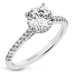 Featuring our new underhalo design, a ring of diamonds sits underneath the center stone in this bridal ring, giving a remarkable side view.