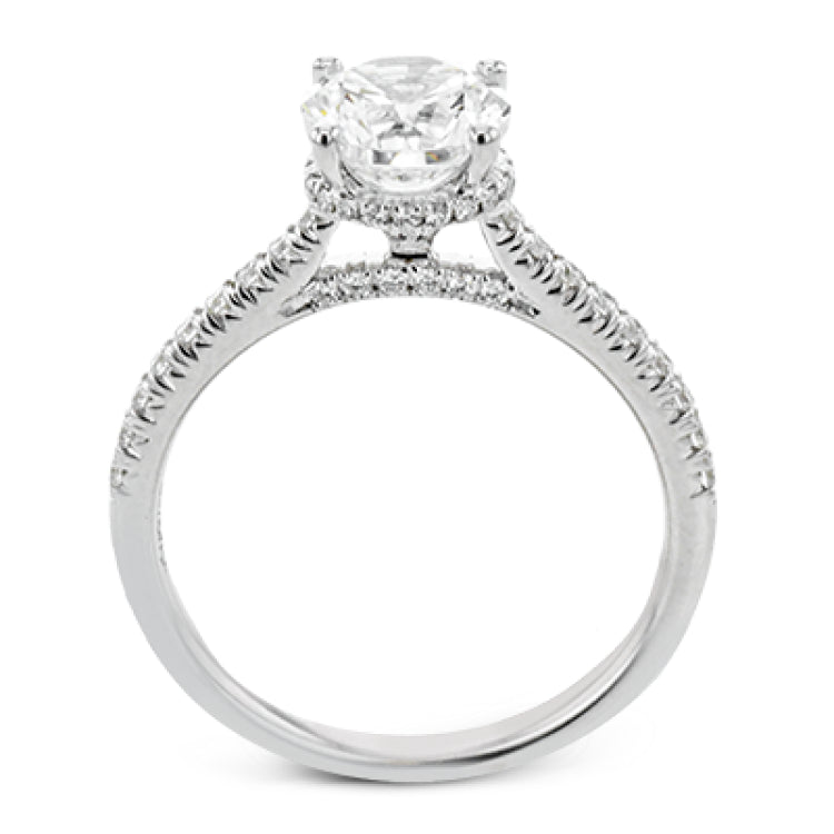 Featuring our new underhalo design, a ring of diamonds sits underneath the center stone in this bridal ring, giving a remarkable side view.
