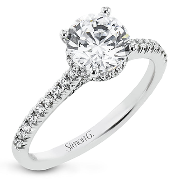 Featuring our new underhalo design, a ring of diamonds sits underneath the center stone in this bridal ring, giving a remarkable side view.