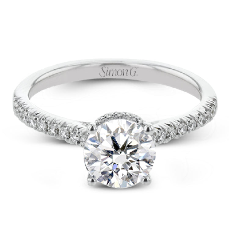 Featuring our new underhalo design, a ring of diamonds sits underneath the center stone in this bridal ring, giving a remarkable side view.