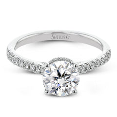 Featuring our new underhalo design, a ring of diamonds sits underneath the center stone in this bridal ring, giving a remarkable side view.