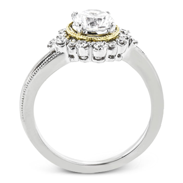 Full of interesting design details, this engagement ring from our Supernova collection features a yellow gold milgrain halo around the center stone, and an outer halo set with .20 ctw of white diamonds.
