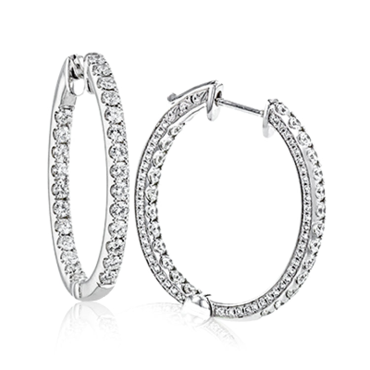 You can't go wrong with classic hoop earrings, especially these ones with diamonds inside and out that will sparkle in all directions.