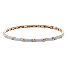Stacked or worn alone, this enamel bangle provide the perfect touch, with .21 ctw of white bezel set diamonds.