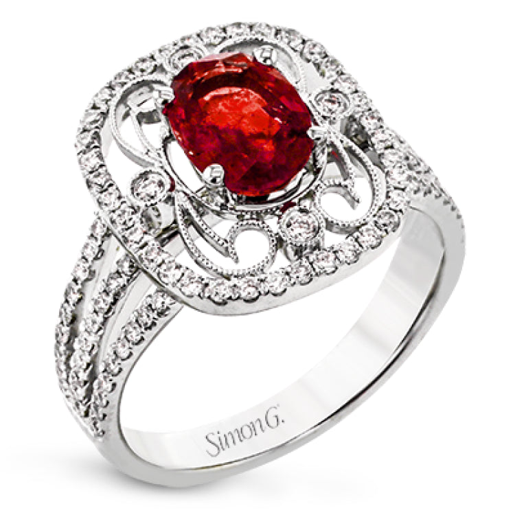 Delicate filigree adorns this vintage inspired ring, while a stunning gemstone center lends an essential dose of color.
