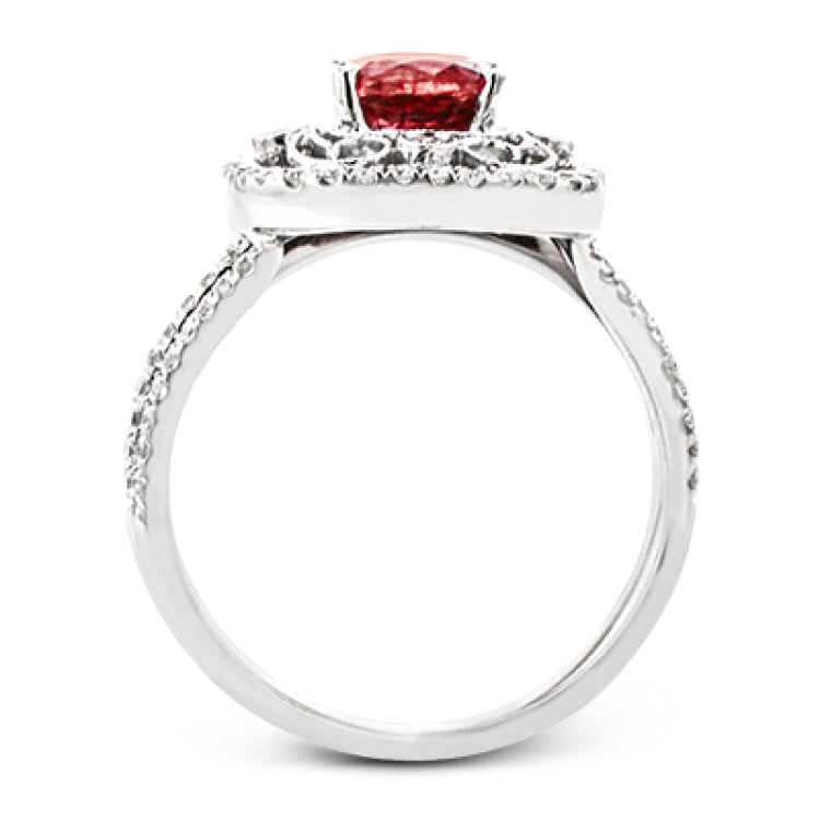 Delicate filigree adorns this vintage inspired ring, while a stunning gemstone center lends an essential dose of color.