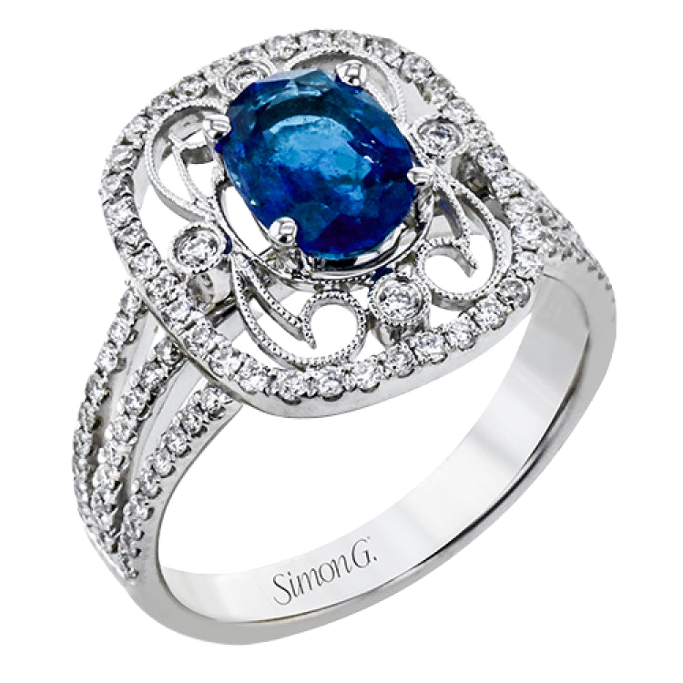 Delicate filigree adorns this vintage inspired ring, while a stunning gemstone center lends an essential dose of color.