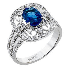 Delicate filigree adorns this vintage inspired ring, while a stunning gemstone center lends an essential dose of color.
