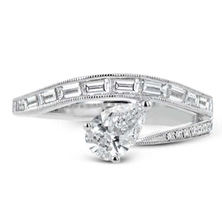 Like lightning zig-zagging across the sky, this dynamic 18k white gold ring contains a flowing line of .62 ctw baguette diamonds and one .55 ct pear shaped diamond set at an angle.