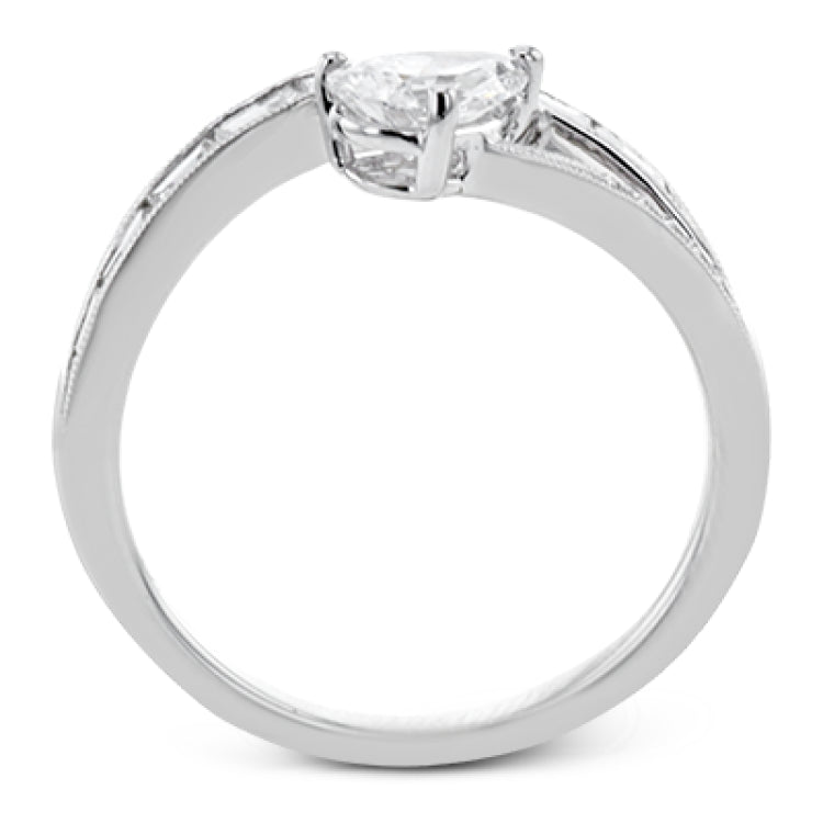 Like lightning zig-zagging across the sky, this dynamic 18k white gold ring contains a flowing line of .62 ctw baguette diamonds and one .55 ct pear shaped diamond set at an angle.