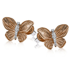 These charming butterfly earrings alight on the ears, crafted in 18k yellow gold with .12 ctw of white diamonds.