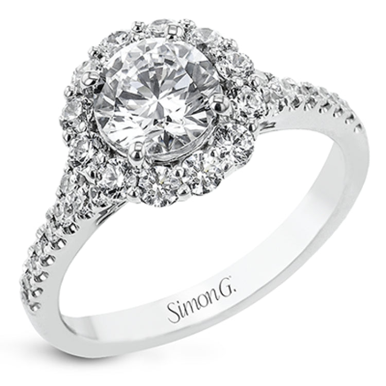 This lovely engagement ring provides an impressive amount of sparkle with .73 ctw in a halo design.