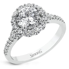 This lovely engagement ring provides an impressive amount of sparkle with .73 ctw in a halo design.