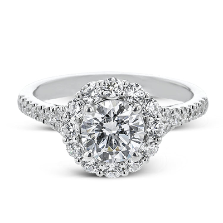 This lovely engagement ring provides an impressive amount of sparkle with .73 ctw in a halo design.