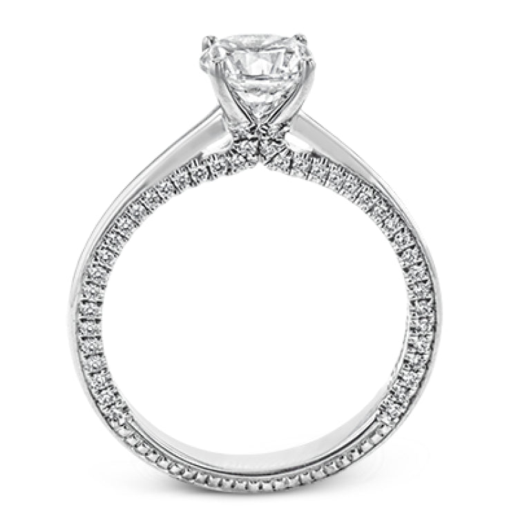While lines of diamonds extending down both sides of this engagement ring, the round center stone is enhanced by the pure beauty of the 18k white gold on top.