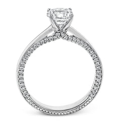 While lines of diamonds extending down both sides of this engagement ring, the round center stone is enhanced by the pure beauty of the 18k white gold on top.