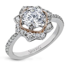 This detailed 18k white and rose gold ring design features .43 ctw of white diamonds.