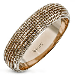 This 14k gold band features a granulated surface that is hand-created by experienced artisans.