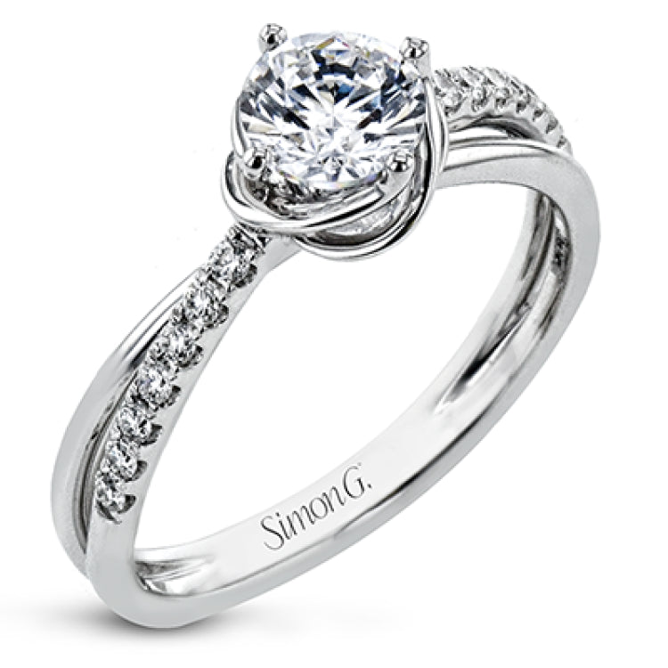 This criss-cross design engagement ring shimmers with 0.15 ctw round diamonds and a halo of gold strands wrapped around the center