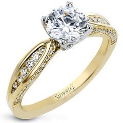 Delightful details abound in this 18k white gold engagement ring, set with .33 ctw of side diamonds.