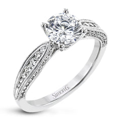 Delightful details abound in this 18k white gold engagement ring, set with .33 ctw of side diamonds.