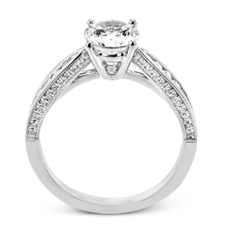Delightful details abound in this 18k white gold engagement ring, set with .33 ctw of side diamonds.