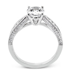 Delightful details abound in this 18k white gold engagement ring, set with .33 ctw of side diamonds.