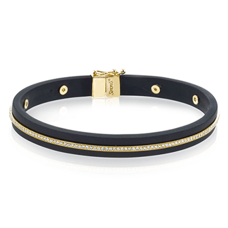 A sleek line of .39 ctw of diamonds makes a statement in this black rubber bracelet with 14k gold elements.