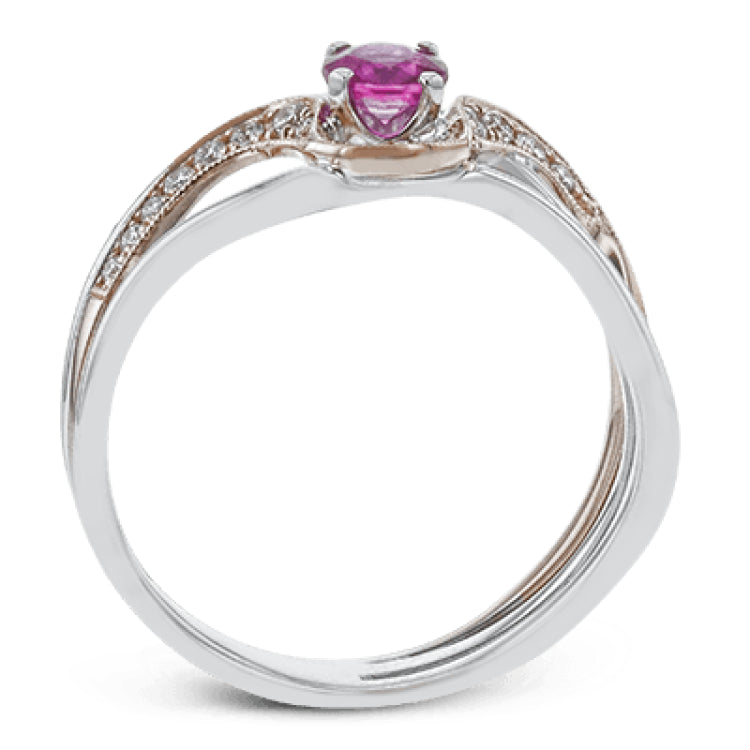 This exceptional two-toned 18k gold design features an organic undulating design set with a .42 ct ruby and .17 ctw of white diamonds.